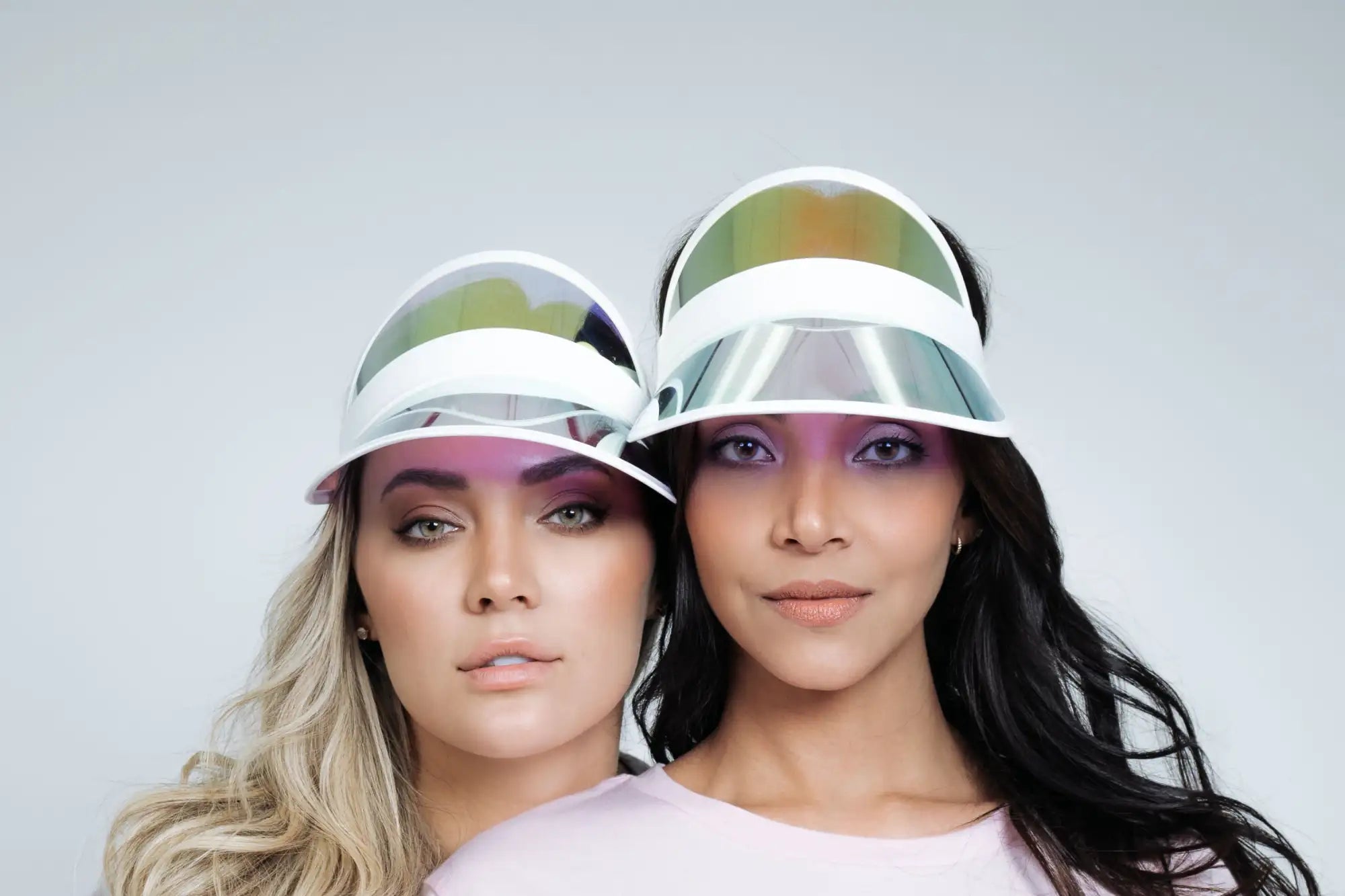 White visor with a reflective, iridescent front panel.